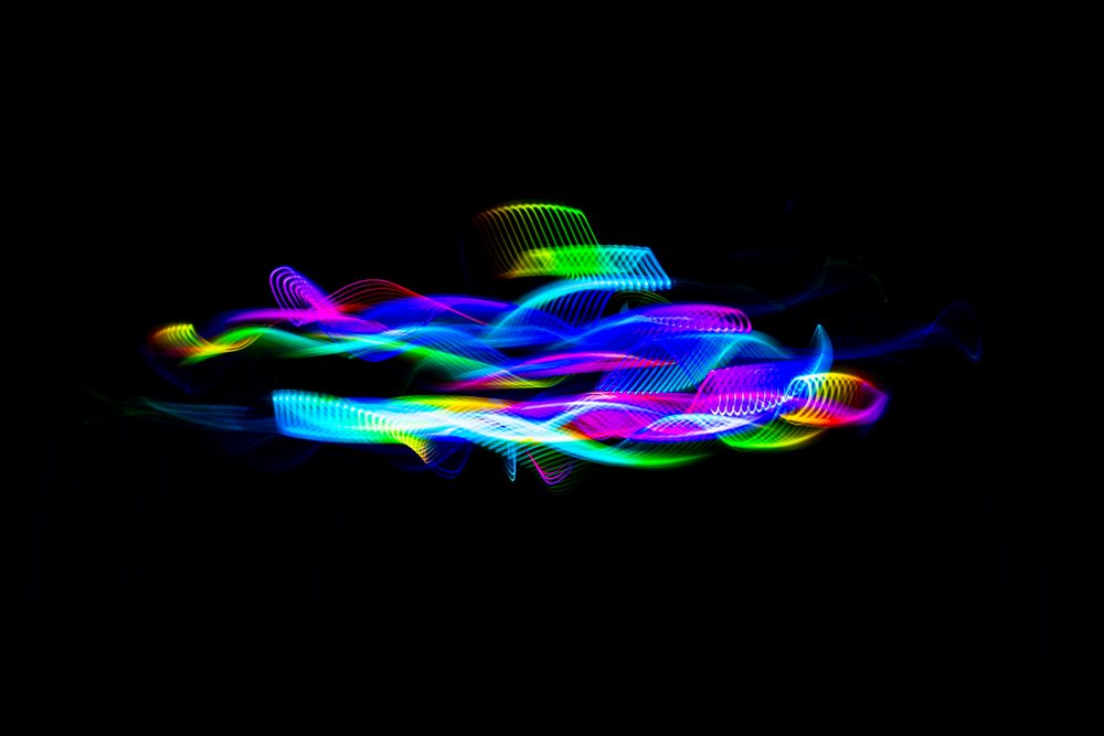 Colorful abstract light painting created with moving LED lights on a dark background.
