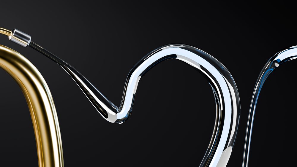 Curved stainless steel and gold metal tubes with reflective surfaces against a black background.