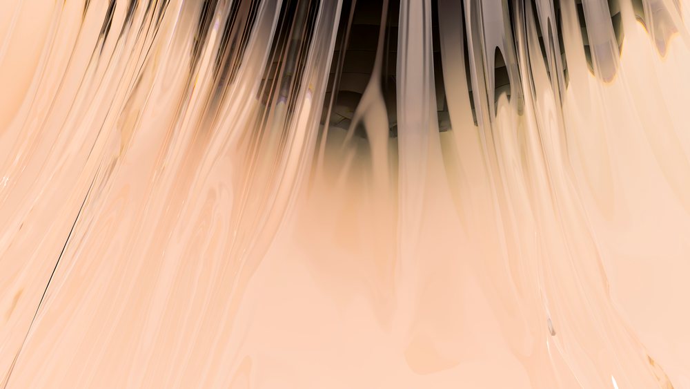 Close-up of creamy light beige liquid pouring smoothly with a glossy texture.