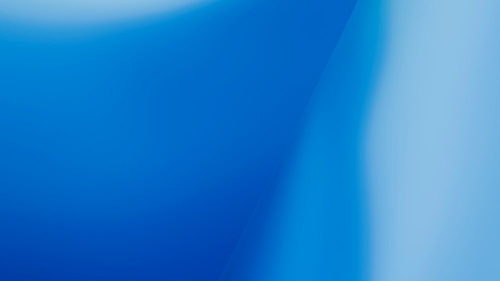 Blue smooth gradient abstract background with blended shades of light and deep blue tones.