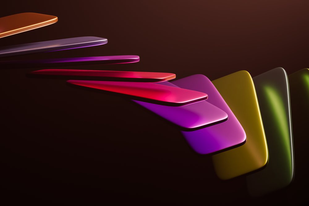 Colorful shiny overlapping rectangular shapes form a modern geometric pattern on a dark background.