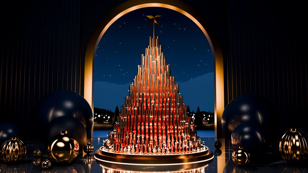 Metallic christmas tree with star and spherical decorations in dark interior.