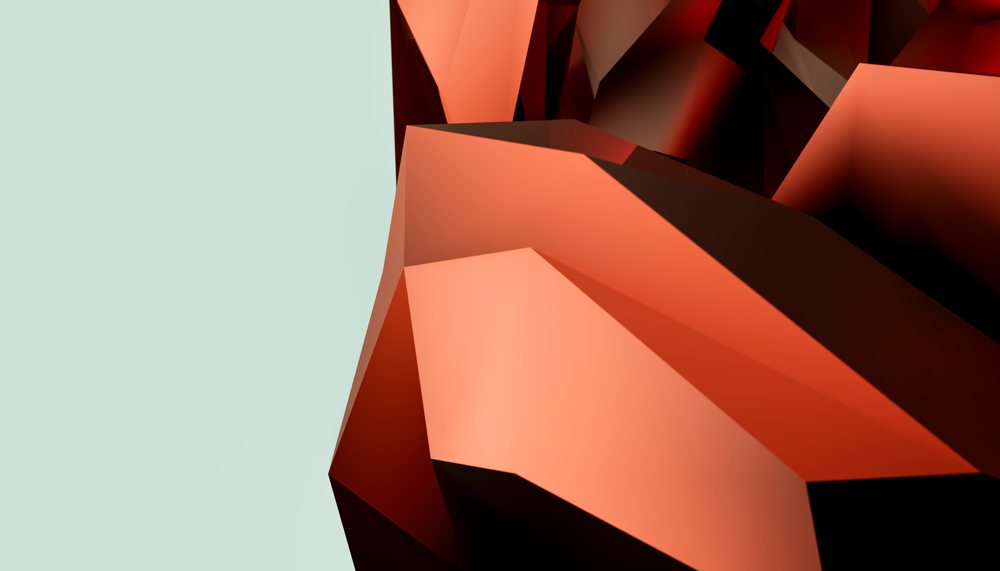 Orange geometric abstract polygonal shape with sharp edges on a light green background.