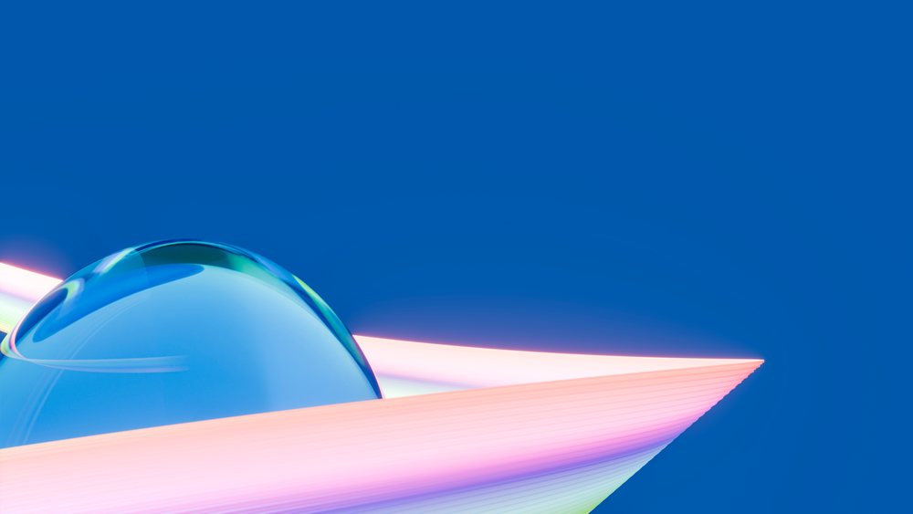 Colorful glass sphere with pastel ribbons floats against a smooth blue digital background with light reflections.