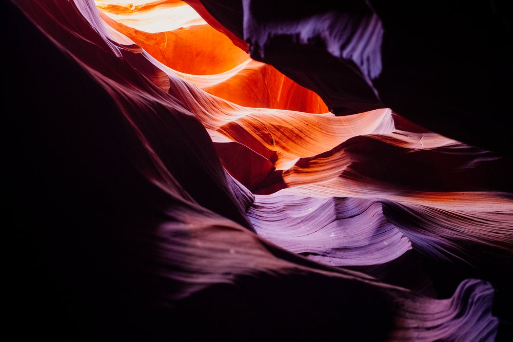 Antelope Canyon, Arizona shows natural curves and colors of sandstone slot canyon rock formations, Navajo Land, USA.