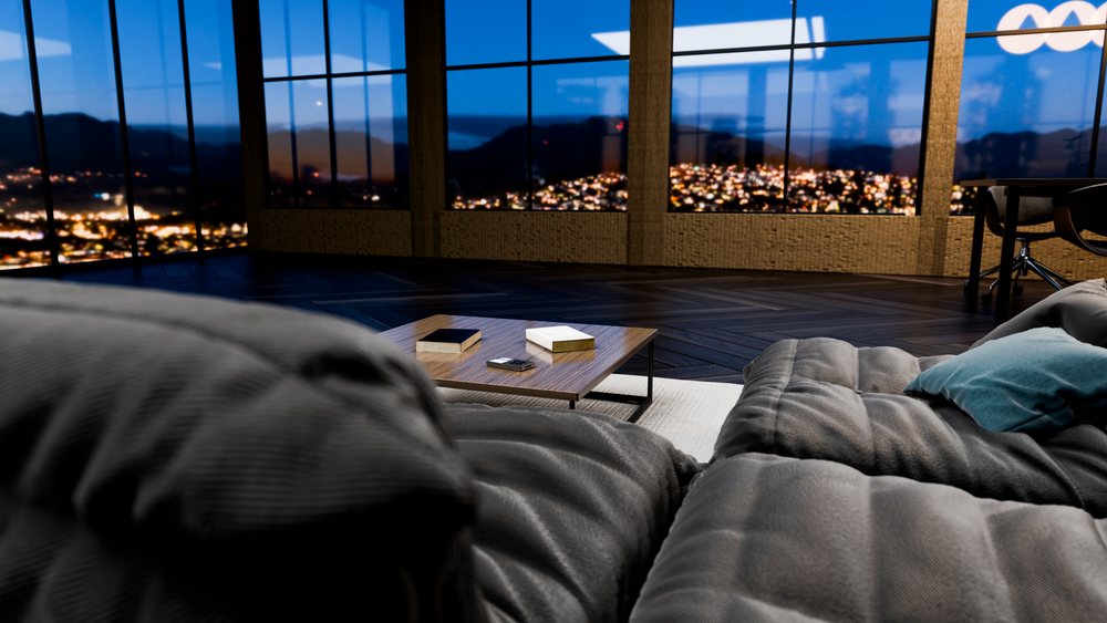 Modern living room with gray sofa and coffee table.