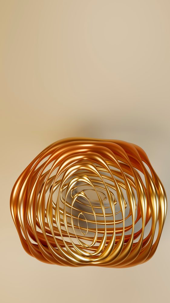 Metallic abstract sculpture featuring flowing gold and bronze curved loops against a neutral background under studio lighting.