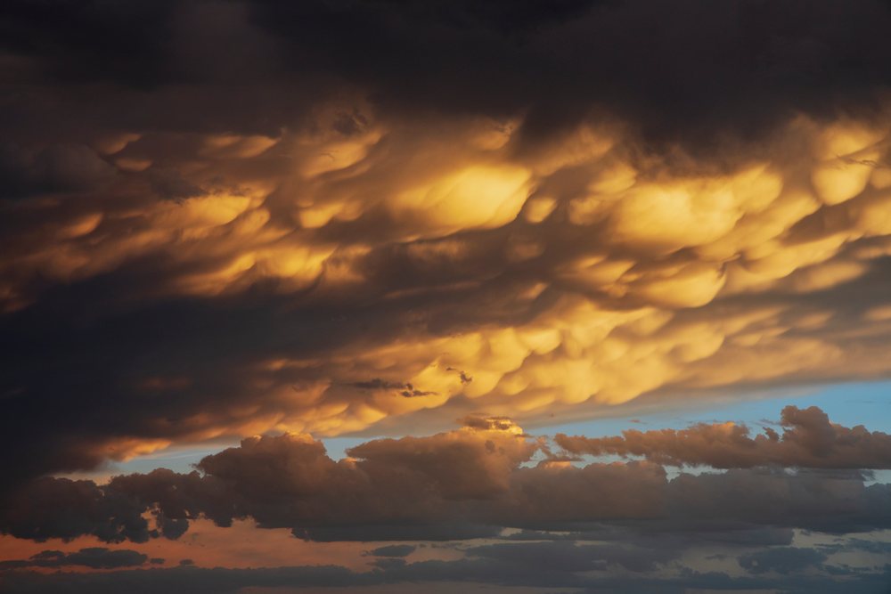Mammatus clouds illuminated by Sunset light over Post in the Great Plains, Storm Chasing, Weather, Environment, Texas, USA.
