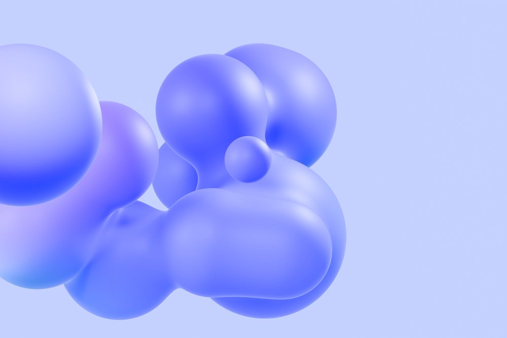 Cluster of abstract blue spheres with smooth shapes on a soft gradient background.