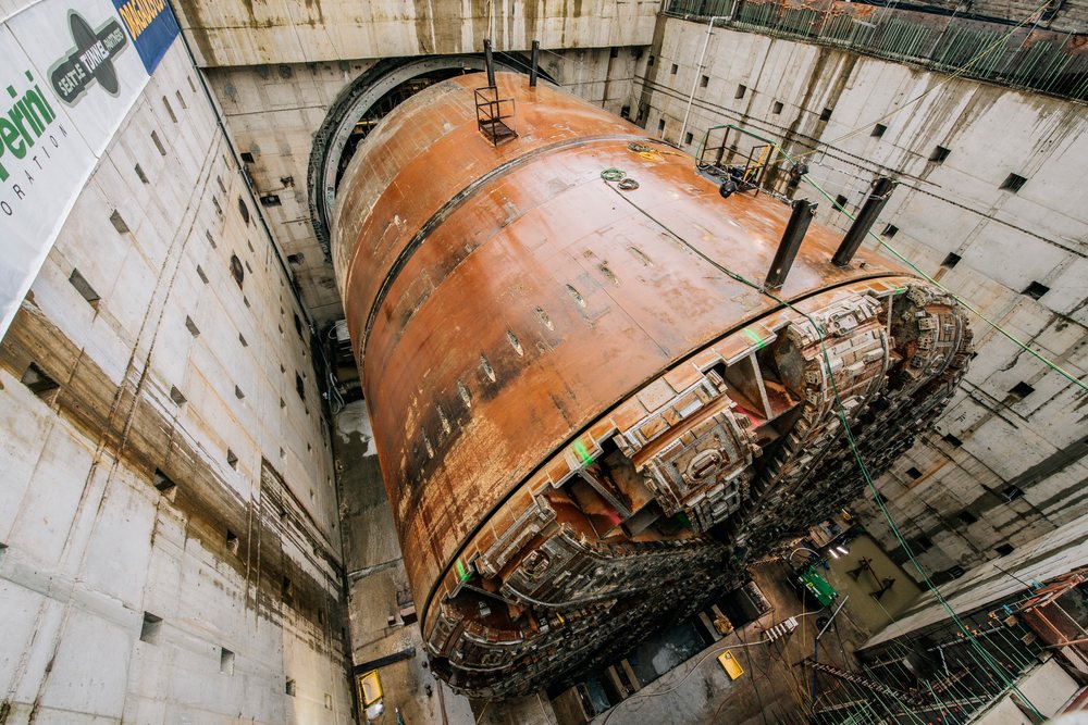 A large tunnel boring machine is positioned in a vertical construction shaft during tunneling work, a large tunnel boring machine, drilling, USA.