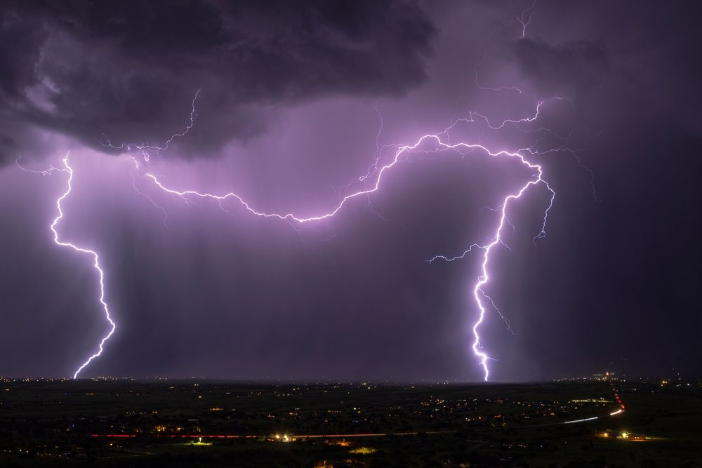 Multiple Lightning bolts strike during a thunderstorm at night over Sierra Vista, Storm Chasing, Weather, Environmental Issues, Arizona, USA.