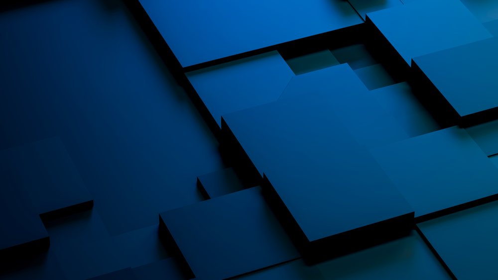 Blue overlapping geometric blocks form a modern digital background symbolizing AI, hardware, compute, and data center technology with depth and shadow.