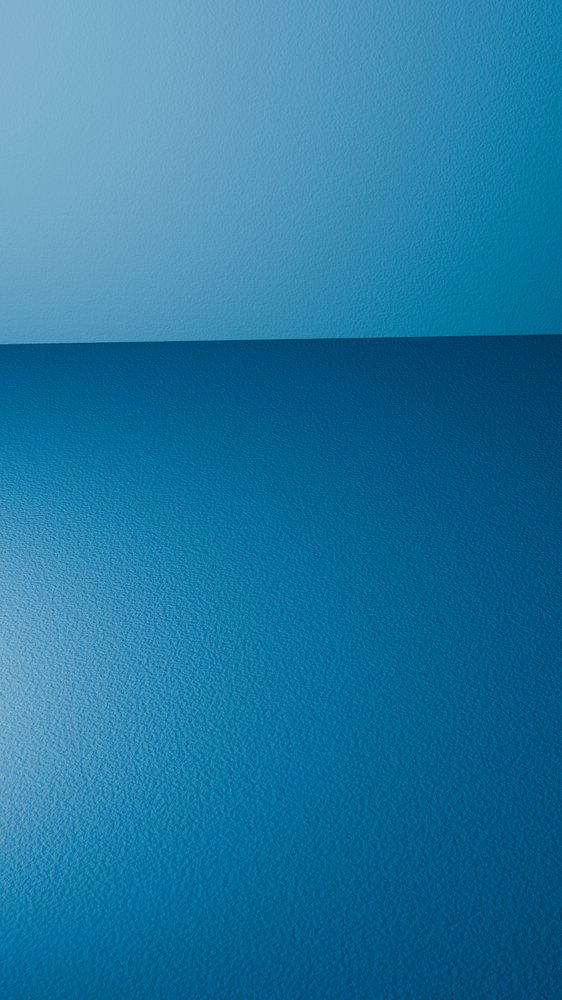 Corner of an empty room with blue textured wall and blue textured floor in a minimalist interior.