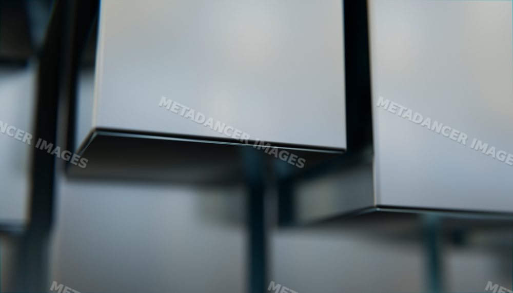 Close-up of stacked metallic rectangular boxes with smooth surfaces