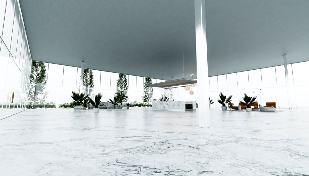 Spacious modern interior with marble flooring and indoor plants.