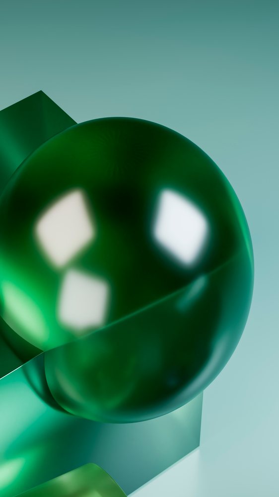 Abstract digital illustration of a glossy green sphere intersecting a green cube on a soft teal background.