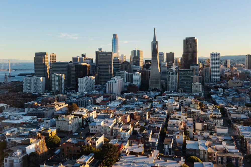 Downtown San Francisco skyline from Coit Tower at sunset showing notable city skyscrapers and waterfront area, Cityscapes, City Life, California, USA.