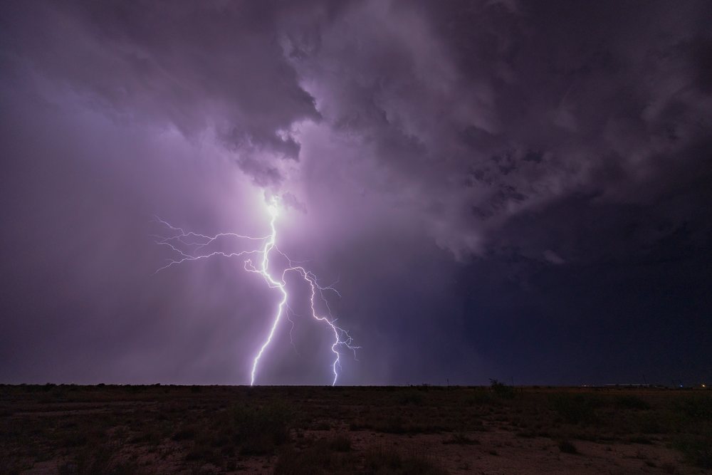 Haboob Storm with multiple Lightning strikes beneath dark Storm clouds over McNeal at night in a desert landscape, Storm Chasing, Weather, Environmental Issues, Arizona, USA.