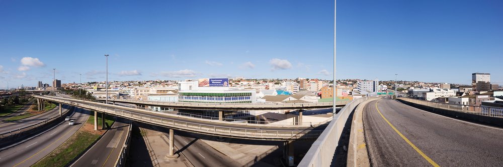 Highways and overpasses lead into Port Elizabeth urban area, South Africa under a clear blue sky, Eastern Cape.