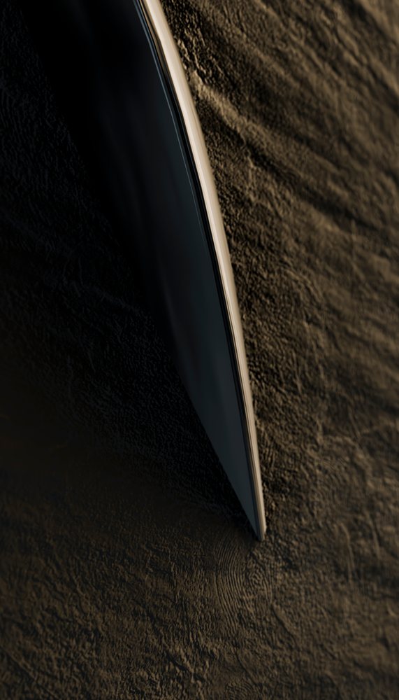 Boat hull cutting through dark rippling water surface at night in a moody setting.