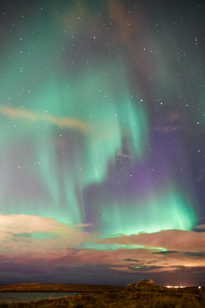 Aurora borealis lights up the night sky over Iceland's natural