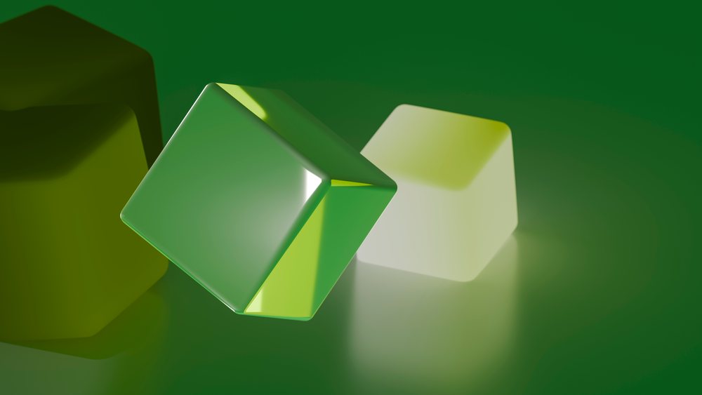 Two floating cubes, one green and reflective and one white and translucent, against a green background in a digital 3D illustration.