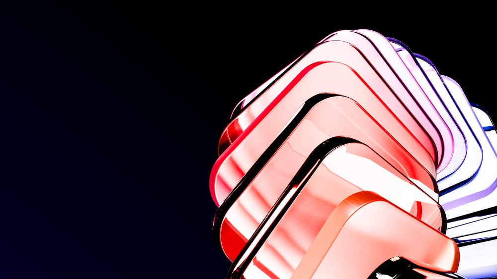 Abstract sculpture composed of stacked curved transparent glass shapes in red and purple on a dark background.