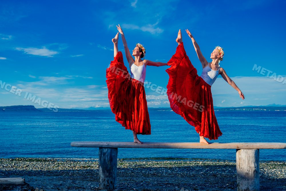 Two white women balancing