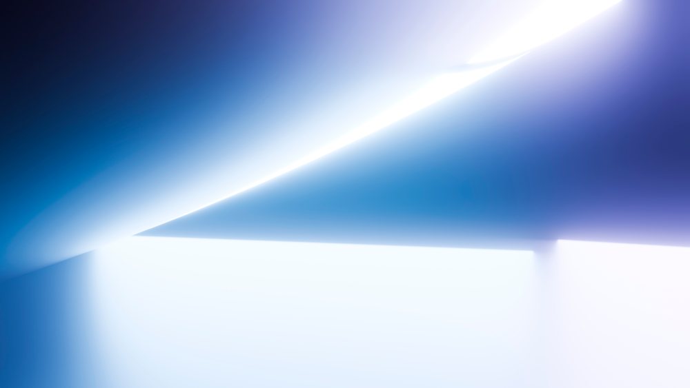 Abstract digital artwork featuring blue gradients, soft light, and geometric shapes in a minimalist modern style.