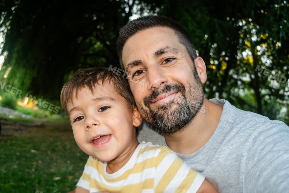 Father and son sharing a happy moment outdoors