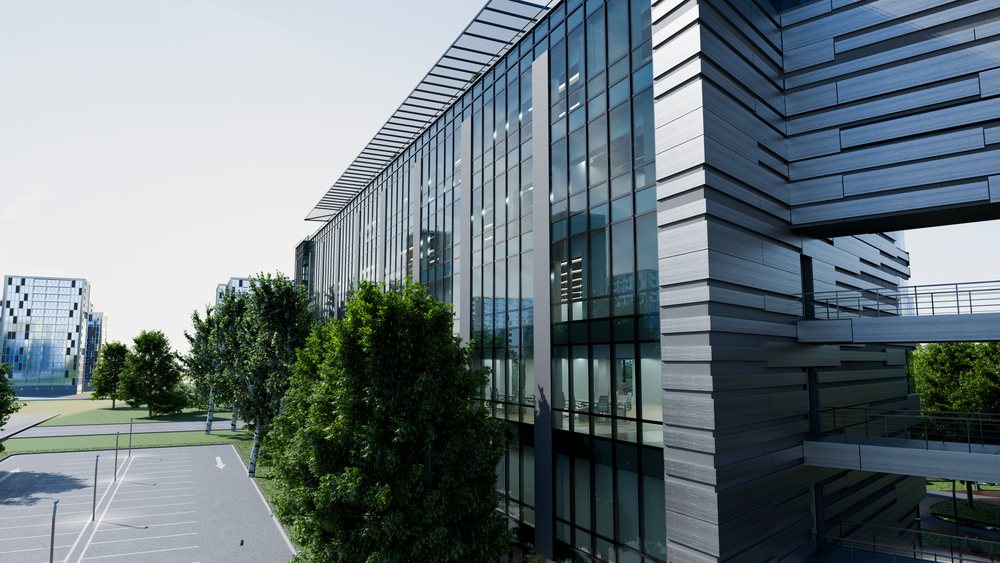 Modern commercial building with metal panel facade, glass walls, and trees beside an empty parking lot under daylight.
