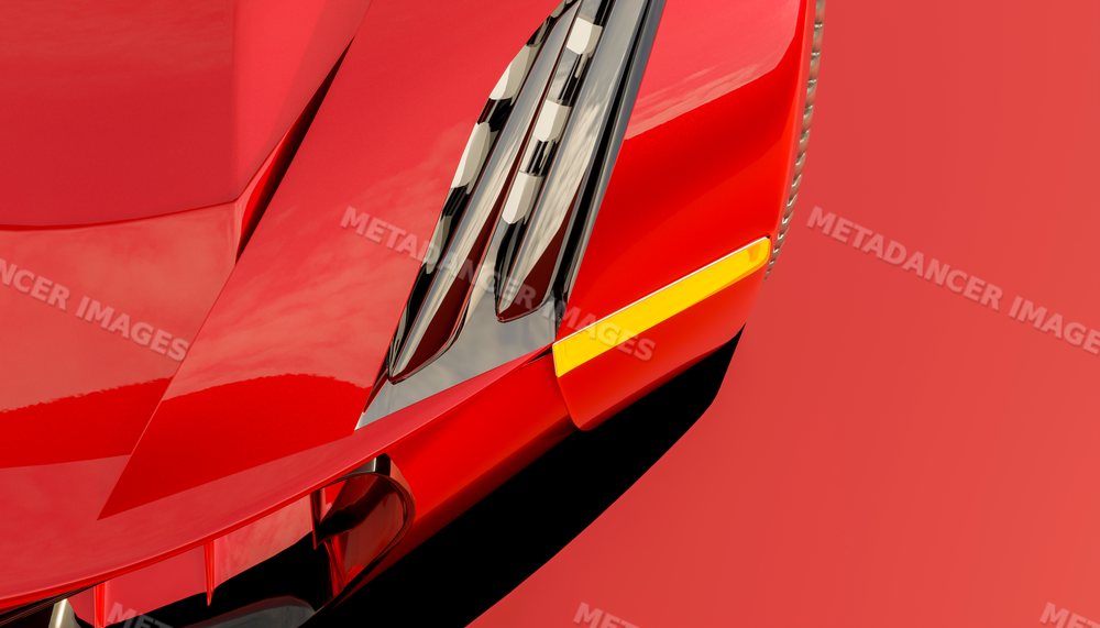 Close-up of the front hood and headlight assembly of a red vehicle