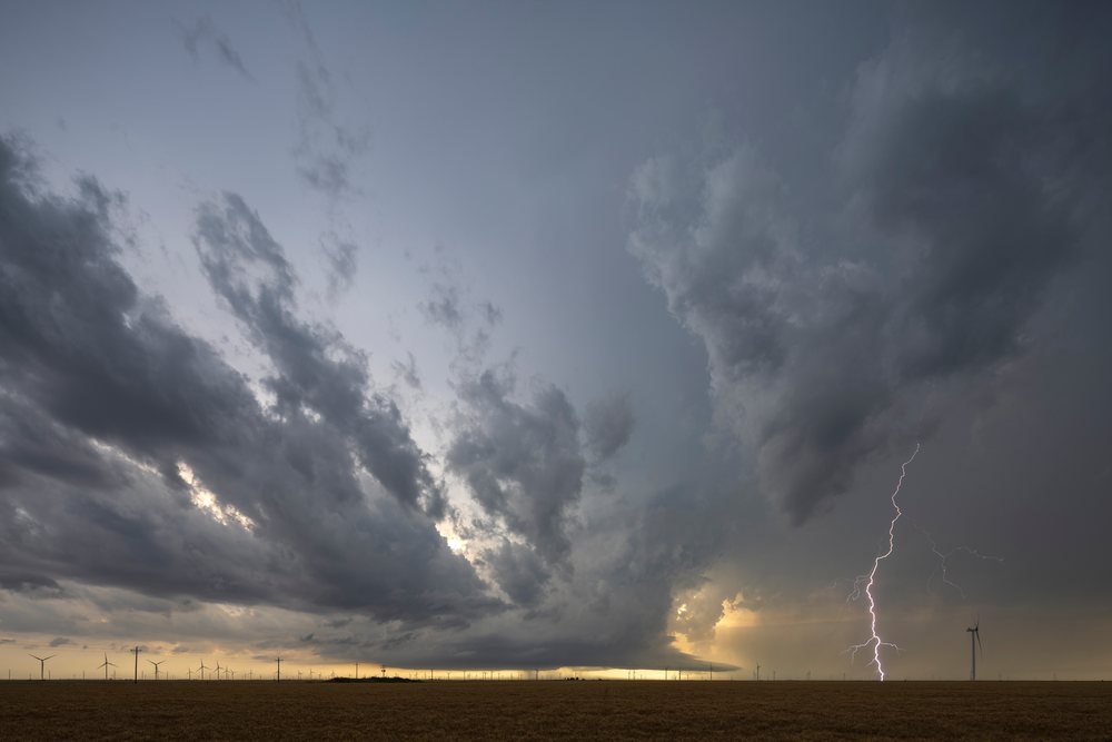 Lightning from a Supercell stalled against an Outflow Boundary over a wind farm, Storm Chasing, Booker, Texas, USA.