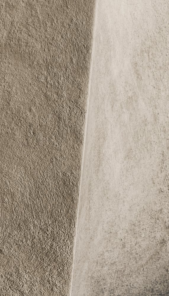 Close-up of textured concrete wall with two vertical panels