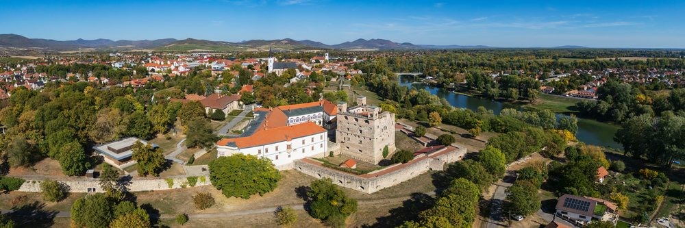 Historic Sárospatak Castle stands by a river, Hungary.