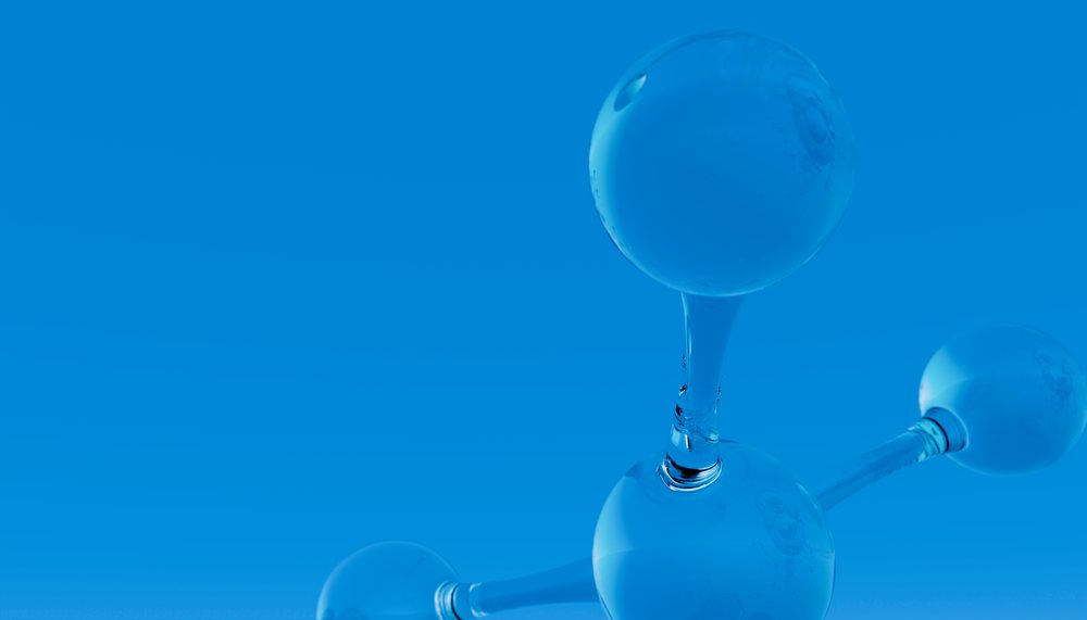 Three-dimensional molecular model showing chemical bonds with transparent spherical atoms on a blue background.