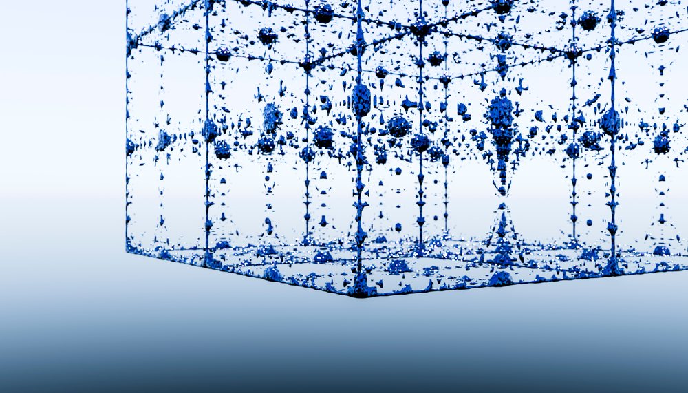 Blue cube formed by suspended water droplets against a blue gradient background.