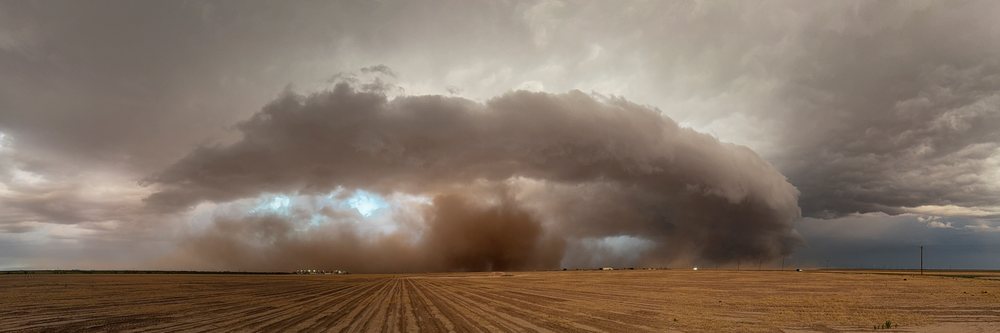 Supercell storm producing a large dust cloud over flat farmland in Tornado Alley, Garden City, Texas, USA.