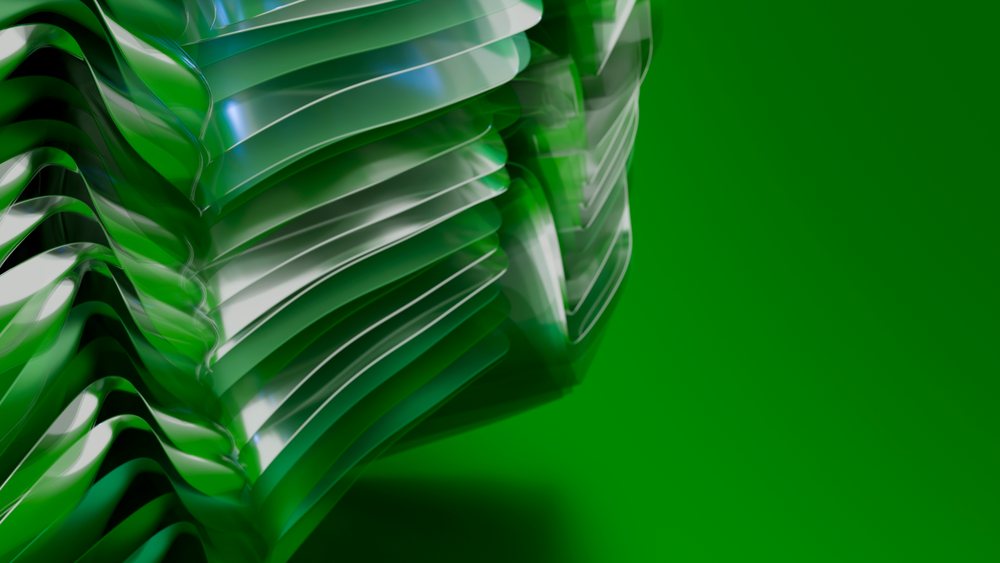 Green abstract layered translucent material with curved surfaces on a green gradient background.