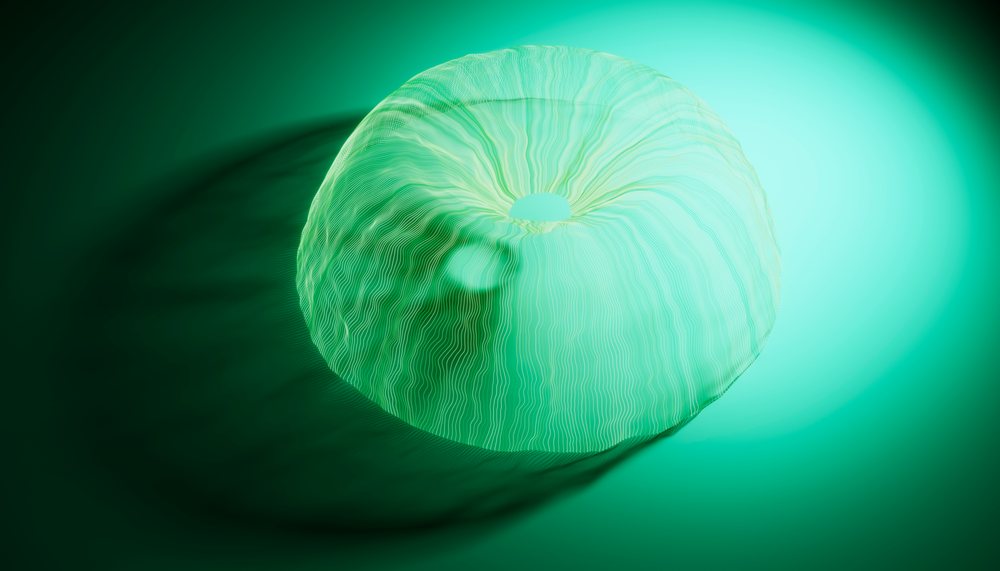 Abstract translucent green ring sculpture with flowing curved lines casting a soft shadow on a green surface.