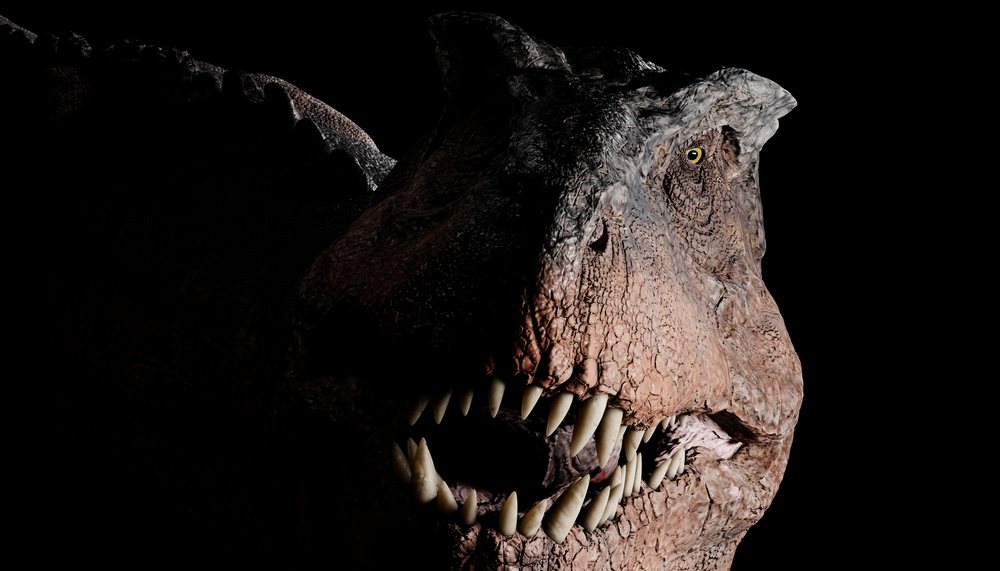 Close-up digital rendering of a T-Rex showing sharp teeth