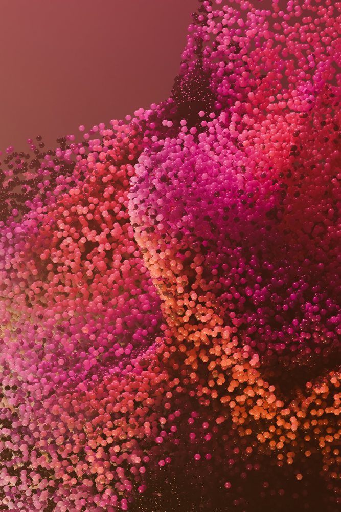 Abstract render of a fragmented digital face composed of red and pink hexagonal particles creating a colorful mosaic effect.