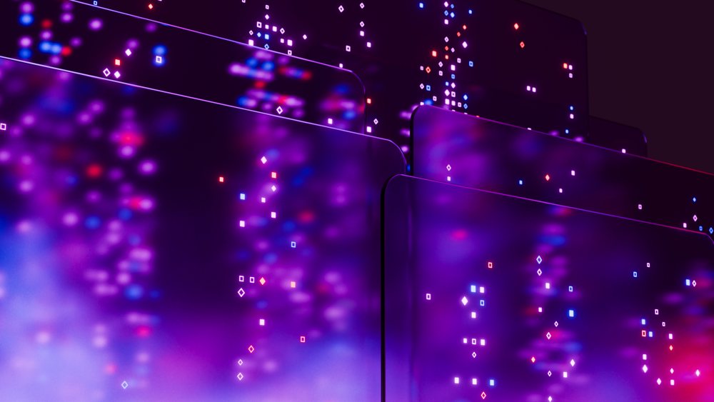 Stacked translucent digital screens displaying an abstract pattern of purple, red, and blue glowing lights in a vibrant technology theme.