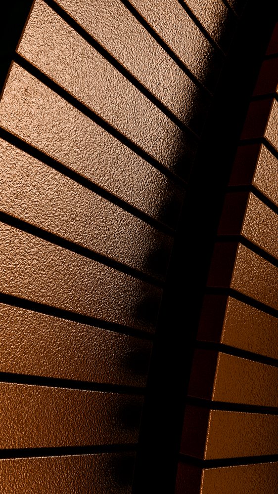 Bronze metal panels display a rough texture with angled abstract pattern and strong shadow contrast in a modern architectural setting.