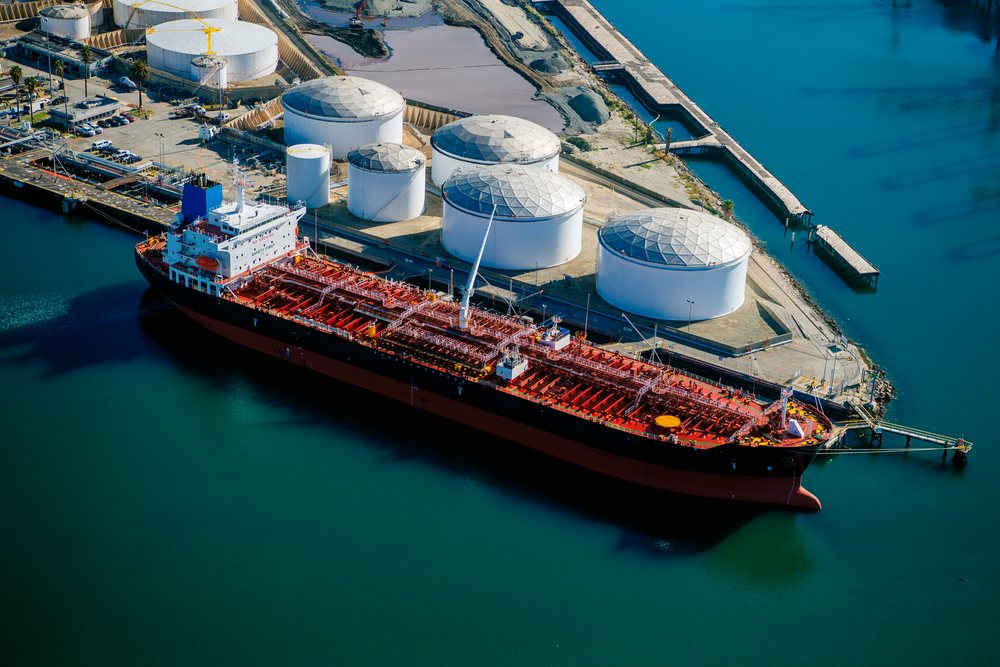 Oil tanker docked at liquid storage tanks in the Port of Long Beach, California, CA, USA.
