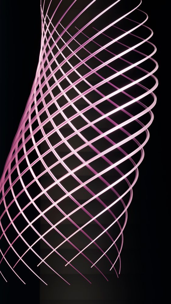 Pink glowing light lines form an abstract spiral pattern on a dark background using light painting technique.