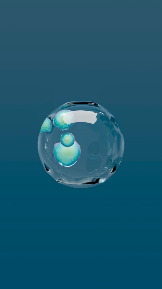 Transparent water bubble with small droplets inside against a blue background.