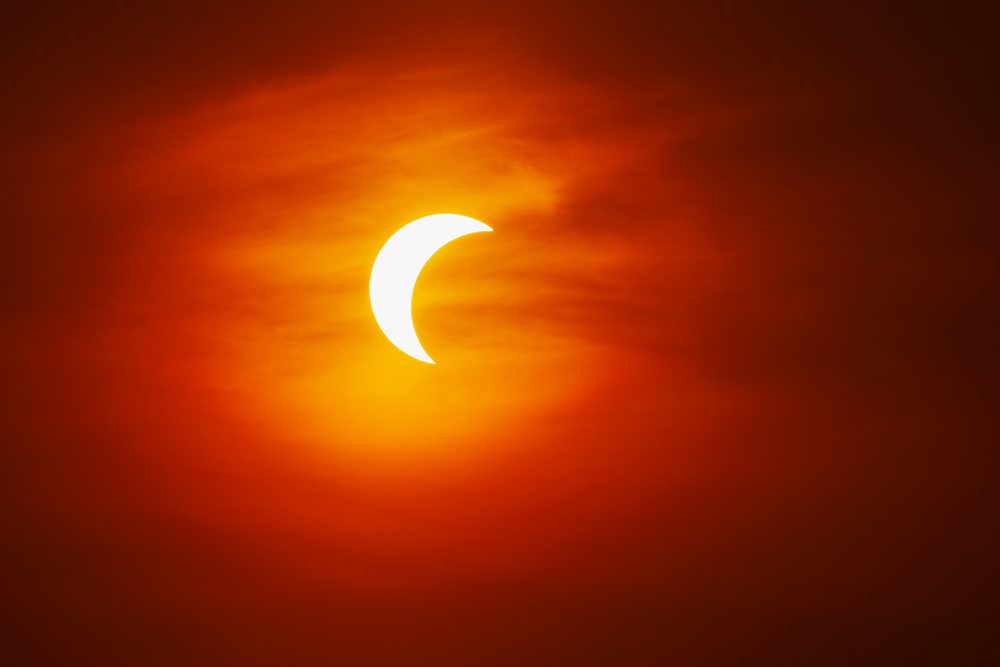 Solar eclipse with the sun partially obscured by the moon in the sky over, Landscape, Lifestyle, Valldemossa, Mallorca, Spain.