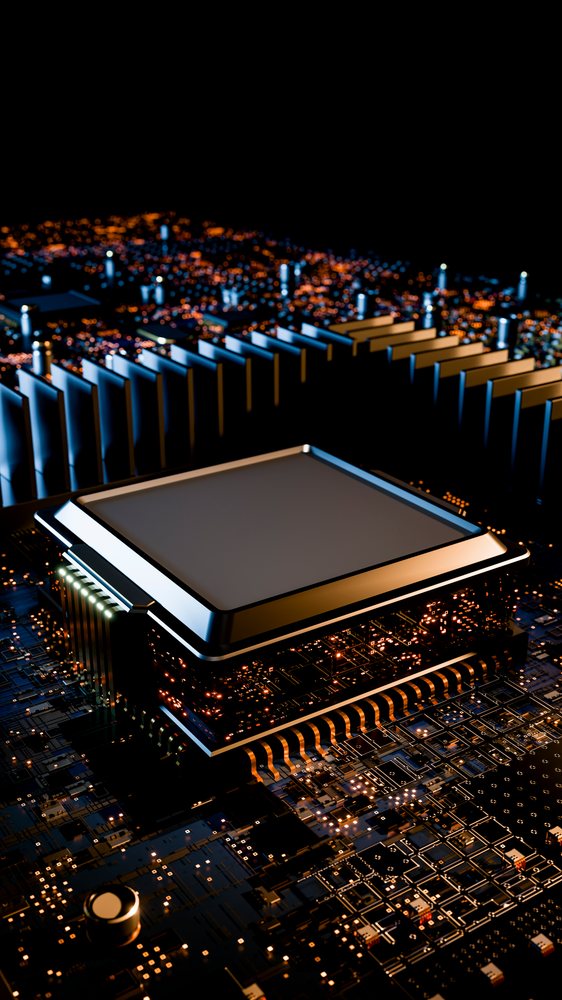 Close-up of a computer microchip with cooling fins on a circuit board.