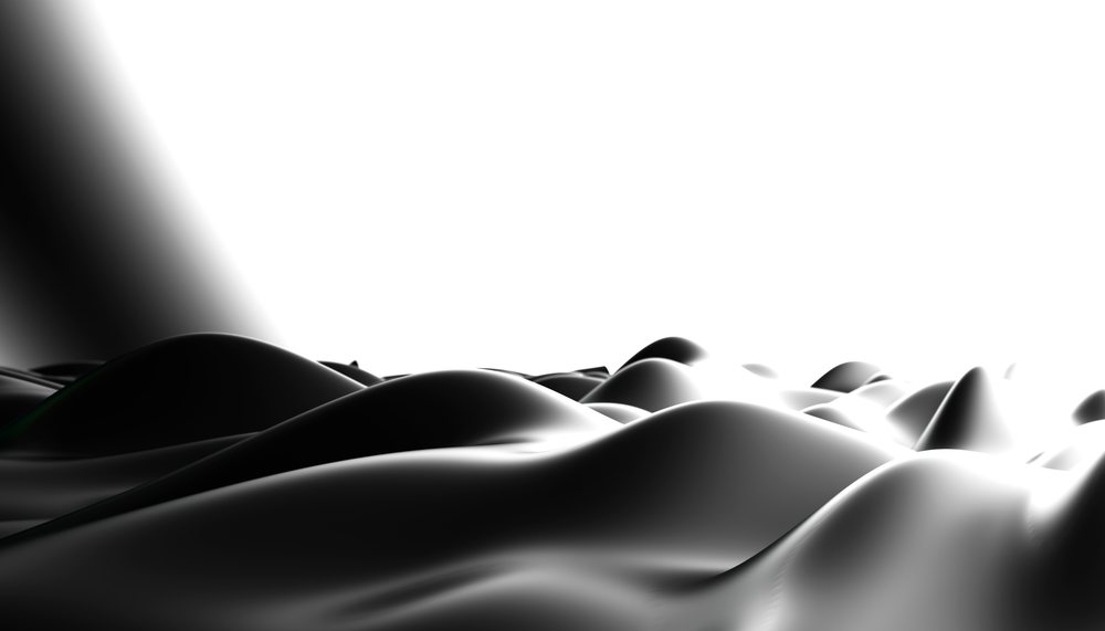 black shiny surface with smooth curved shapes creating an abstract monochrome background.